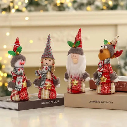 Four adorable Christmas gnome ornaments with red and plaid outfits, pointy hats, and festive designs on books