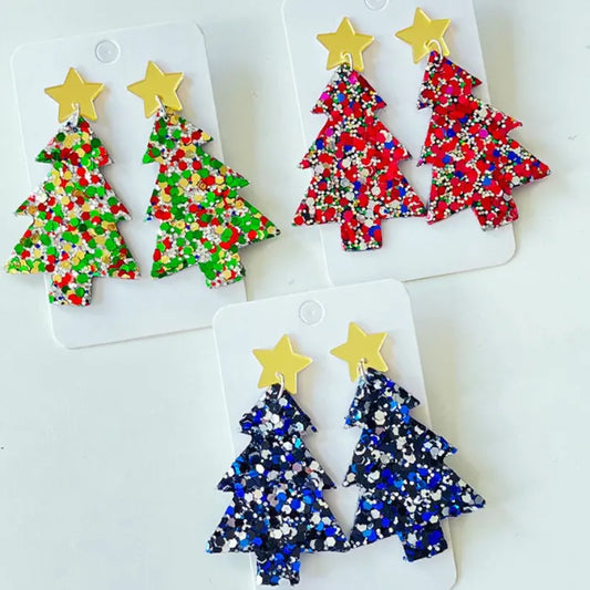 Set of festive Christmas tree earrings with glitter and star accents in green, red, and blue designs.