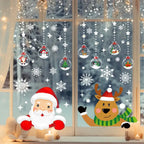 Festive Christmas Window Decals with Santa, reindeer, snowflakes, and ornaments on a night snowy window.