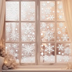 Festive Christmas Window Decals with assorted snowflake stickers on frosted glass in a warm indoor setting.