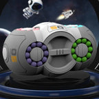 Fidget toy with purple and green beads, showcased in sci-fi setting with astronaut and rocket.