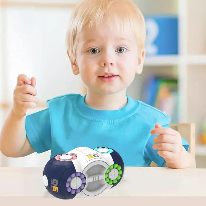 Toddler playing with a fidget toy on table, enhancing hand coordination and motor skills.