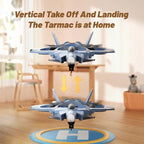 Fighter jet drone hovering indoors showing vertical takeoff and landing with directional arrows.