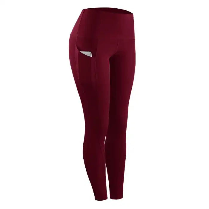 fitness leggings women stretch in maroon featuring a secure side phone pocket