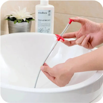 Flexible Pipe Dredging Tool cleaning a bathroom basin drain effectively.