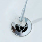 Flexible Pipe Dredging Tool being used to remove debris from a sink drain.