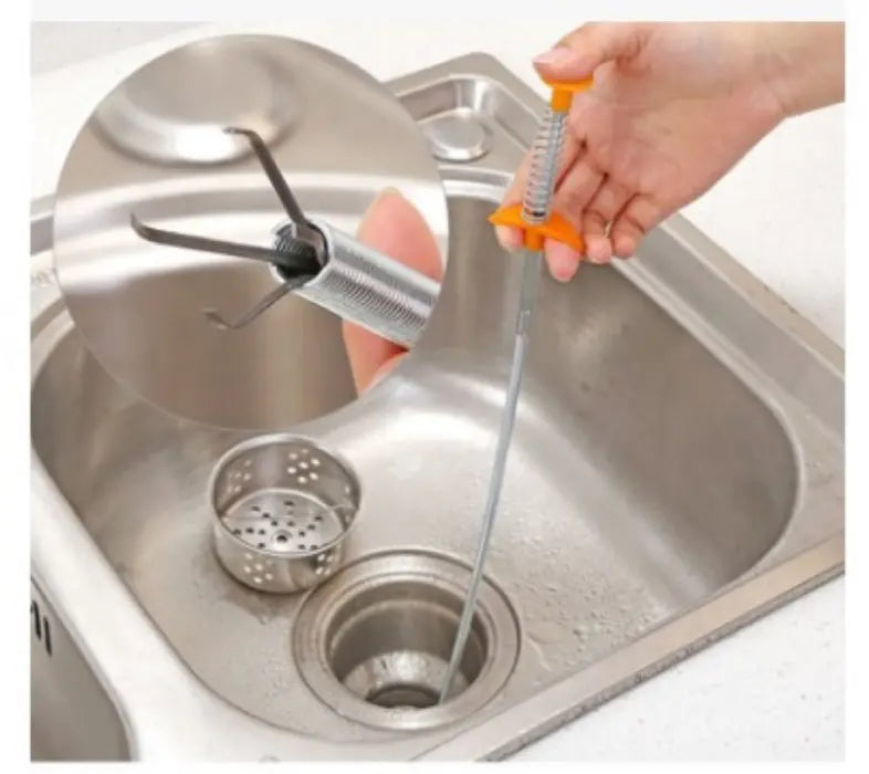 Flexible Pipe Dredging Tool with an orange handle used in a sink drain.