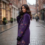 Floral Embroidered Coat in deep purple wool on city street, refined floral embroidery creates a polished winter fashion look