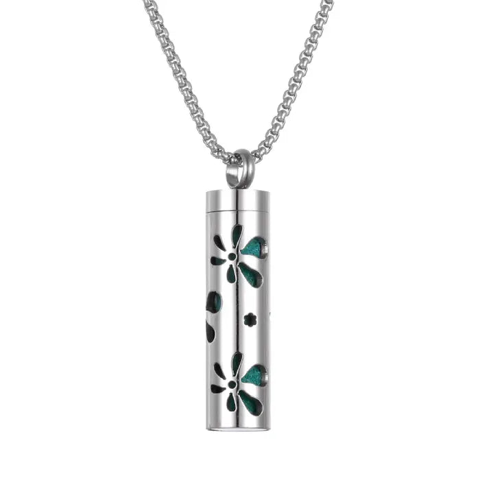 Floral pattern aromatherapy pendant with green accents, designed for essential oil diffusion necklace.