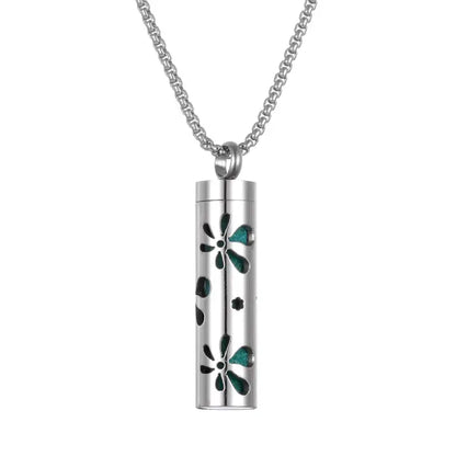 Floral pattern aromatherapy pendant with green accents, designed for essential oil diffusion necklace.