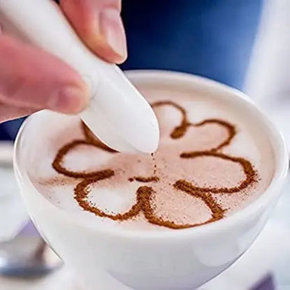 Hand drawing flower pattern in coffee foam with white latte art tool