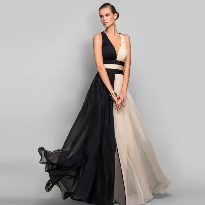 Model demonstrating the beautiful movement of the flowing two tone maxi dress skirt. Buy this elegant V-neck evening dress, an affordable choice for special occasions.