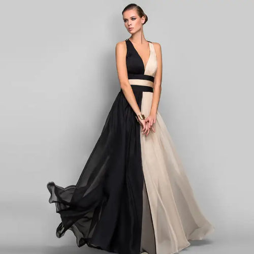 Model demonstrating the beautiful movement of the flowing two tone maxi dress skirt. Buy this elegant V-neck evening dress, an affordable choice for special occasions.