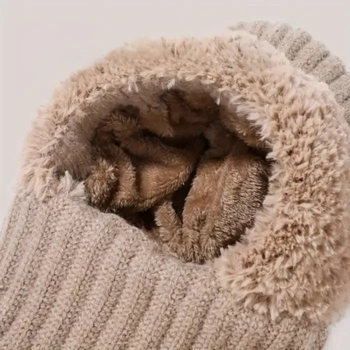 Fluffy beige hooded winter hat and scarf set with fuzzy texture rolled up