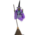 Flying witch yard decor with purple outfit and broomstick isolated on white background for product listing.