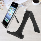 Foldable phone stand shown in use with a phone and separately empty, both placed on a desk setup.
