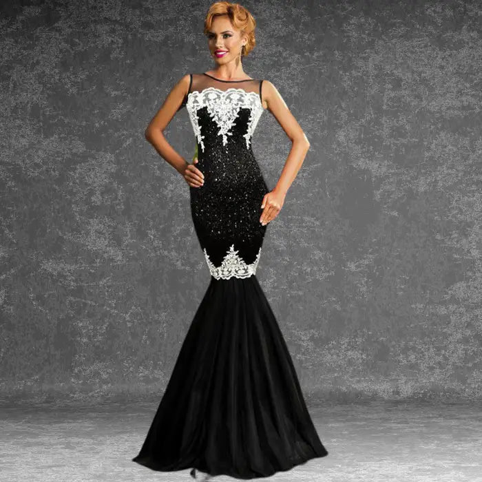 Model looking elegant at a formal event wearing the black and white sequin mermaid dress with a flared tulle hem.