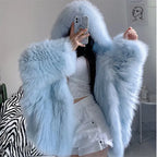 fur hooded coat in soft blue with fluffy faux fur design, stylish oversized silhouette and cozy winter feel for a trending outfit