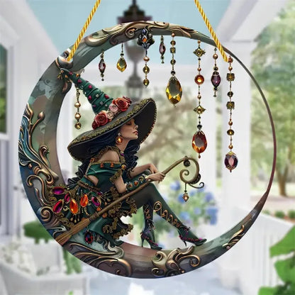 Decorative witch moon suncatcher with gemstone crystals displayed in outdoor garden setting with architectural elements