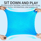  Gel seat cushion showing high elasticity with two hands stretching the blue honeycomb structure.


