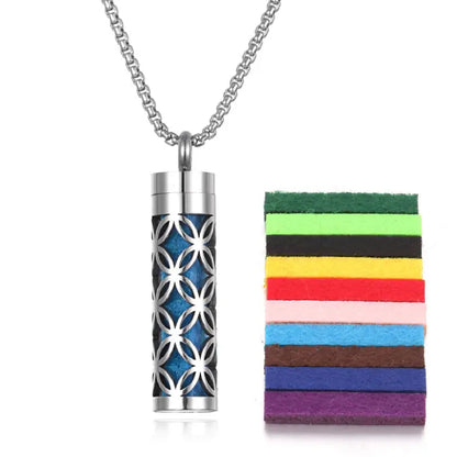 Geometric pattern stainless steel aromatherapy pendant with blue felt pad, perfect for essential oil diffusion.