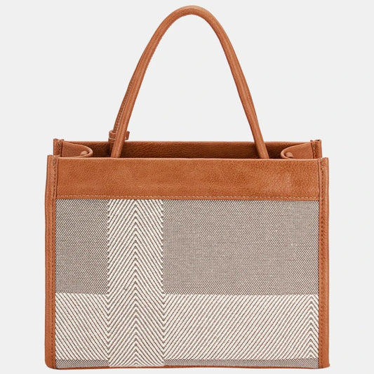 Designer tote bag back view showcasing chevron pattern canvas and cognac leather trim detail for sophisticated style