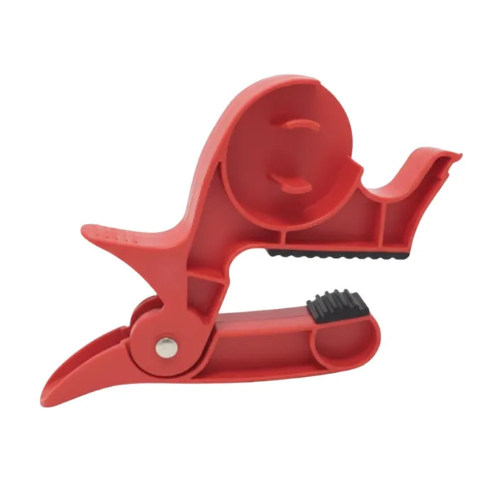 Gift wrapping clamps in sturdy red build shown for tabletop use, helping secure wrapping paper for quick and neat holiday tasks.