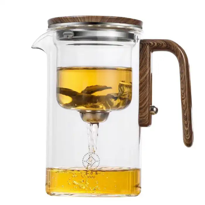 Glass Teapot with One-Click Magnetic Tea Infuser showing automatic tea flow into lower chamber.