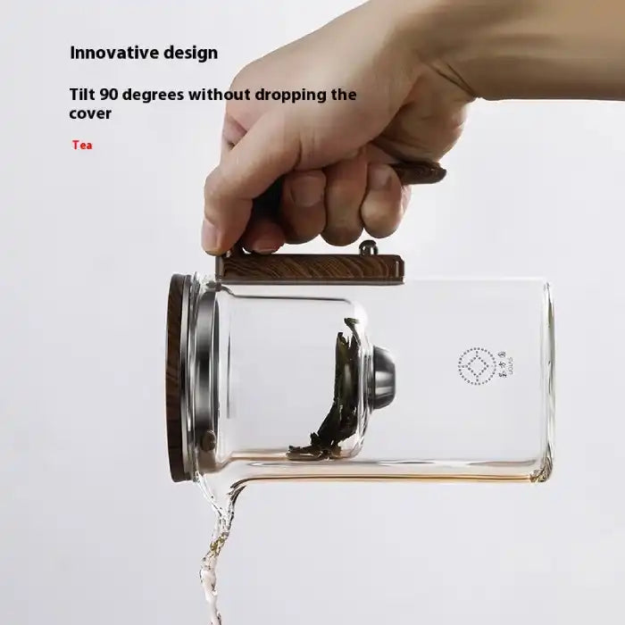  Glass Teapot with One-Click Magnetic Tea Infuser being tilted at 90 degrees without lid falling