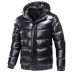 Glossy quilted puffer jacket with hood in black, featuring zip front closure, elastic cuffs, and ribbed hem trim.