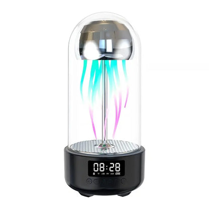 Illuminated jellyfish-shaped light in glass dome with digital clock display and speaker base