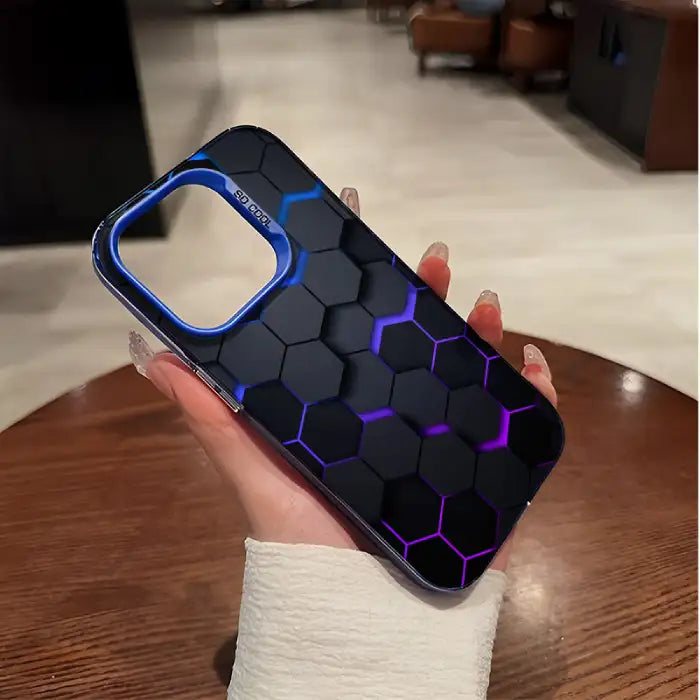 Glowing protective iPhone case featuring black hexagon pattern with blue-to-purple gradient illumination and blue camera frame border