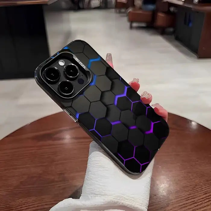 Glowing protective iPhone case with black hexagonal pattern featuring purple-blue illuminated edges and triple-lens camera system