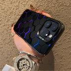 glowing protective iPhone case featuring black hexagonal pattern with purple-blue illuminated edges held in hand with jewelry accessories