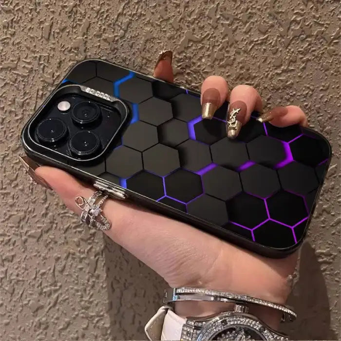Glowing protective iPhone case with black hexagonal pattern illuminated in purple-blue gradient edges and sleek metallic frame design