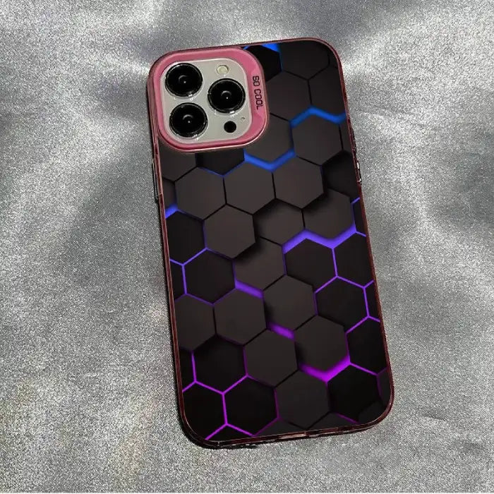 Glowing protective iPhone case with hexagon pattern featuring blue-purple illuminated edges and pink camera frame on silver surface