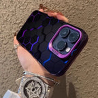 Glowing protective iPhone case featuring black hexagonal pattern with purple-blue illuminated edges and purple camera border