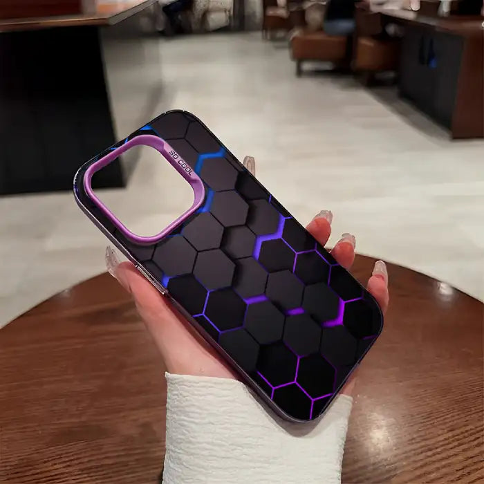 Glowing protective iPhone case with black hexagonal pattern, blue-purple illuminated edges and distinctive purple camera frame