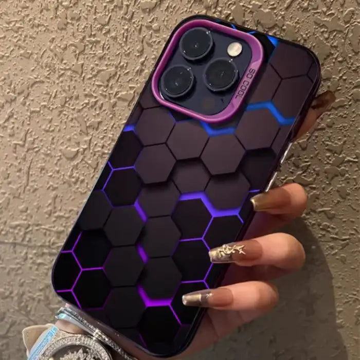 Glowing protective iPhone case with purple illuminated hexagonal pattern and pink camera frame by SO COOL brand