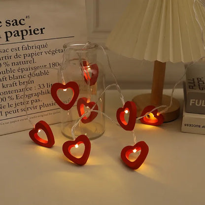 Red heart lights glowing warmly in a glass jar, adding to a cozy interior.