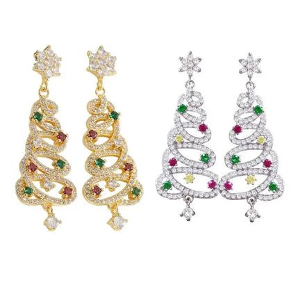 Gold and silver Christmas tree earrings featuring glittering gemstones, showcasing holiday charm and beauty.