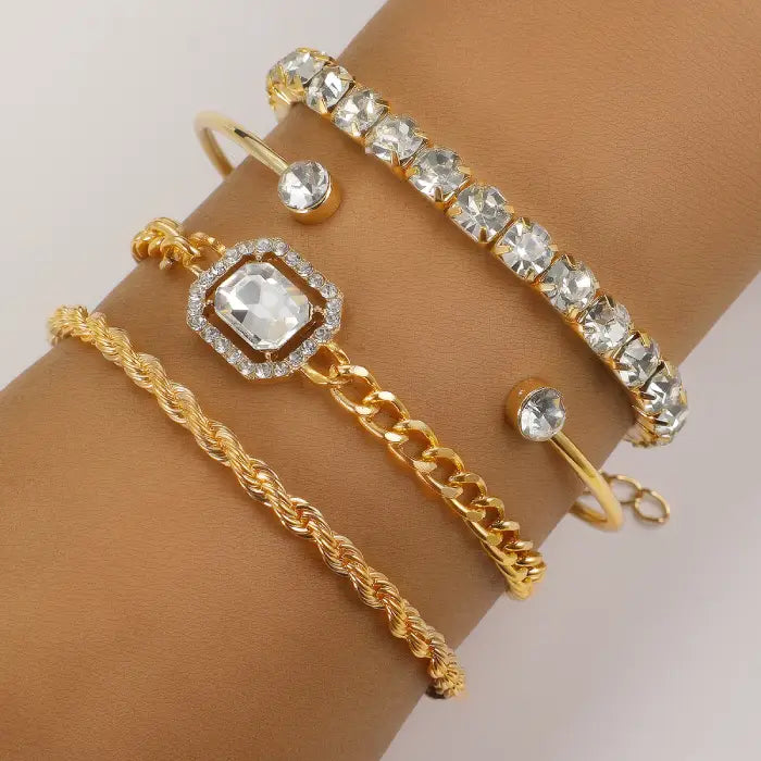 Gold crystal bracelets with a stunning stacked design, ideal for elegant and trendy wrist accessories.