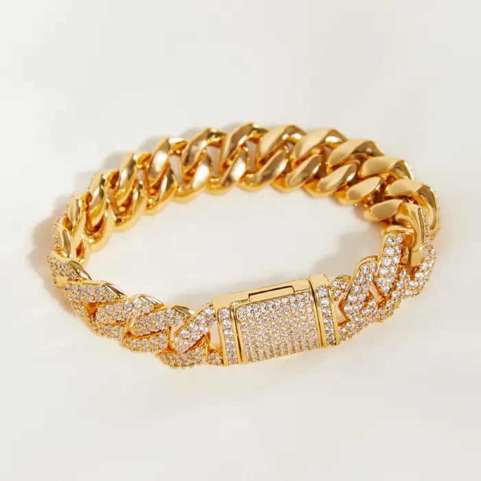 Stylish gold bracelet with diamond details worn on a wrist, perfect for luxurious fashion accessories.