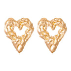 Gold heart Earrings bold textured gold heart stud pair on white background