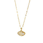 gold seashell necklace with open crystal shell pendant and pearl displayed on clean white background