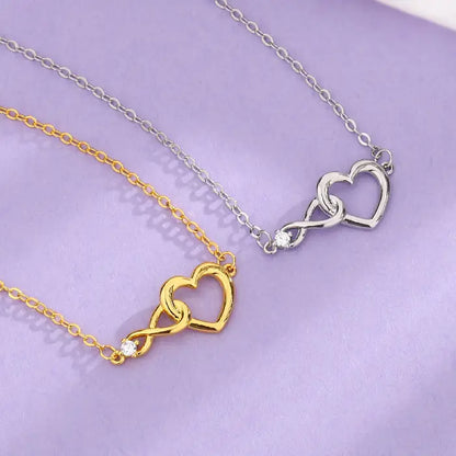 Gold and silver heart infinity necklaces with delicate chains, perfect for women’s fashion accessories.