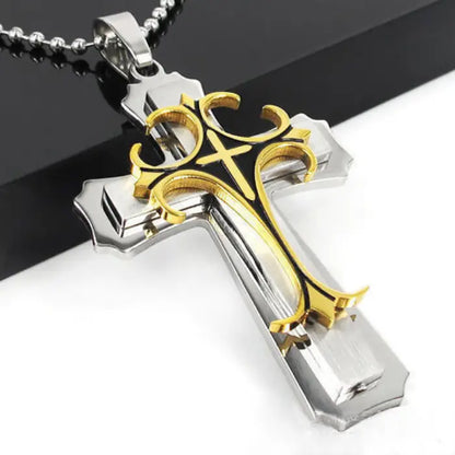 Gold and silver layered cross pendant with intricate design, ideal for men's Christian jewelry collection.