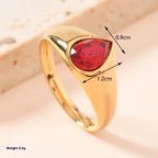 gold teardrop birthstone ring with vibrant red gemstone shown in close-up with size measurements highlighted for detailed jewelry view