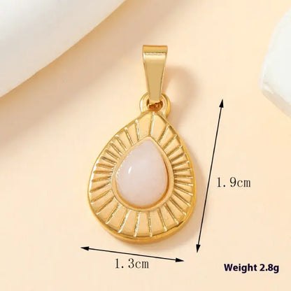 Gold teardrop pink opal stone pendant with engraved rays design, lightweight and stylish for daily wear.