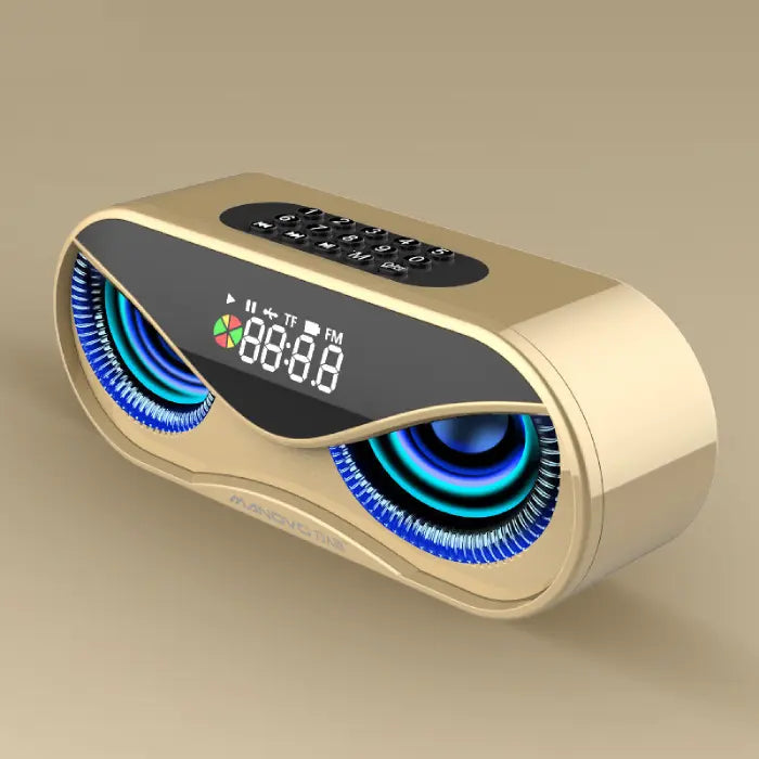 Elegant gold-colored speaker with illuminated displays, digital clock, and keypad on neutral background